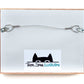 Back of Taylor Stone Illustration frame for cut paper illustrations with cat logo and horizontal wire hook for hanging.