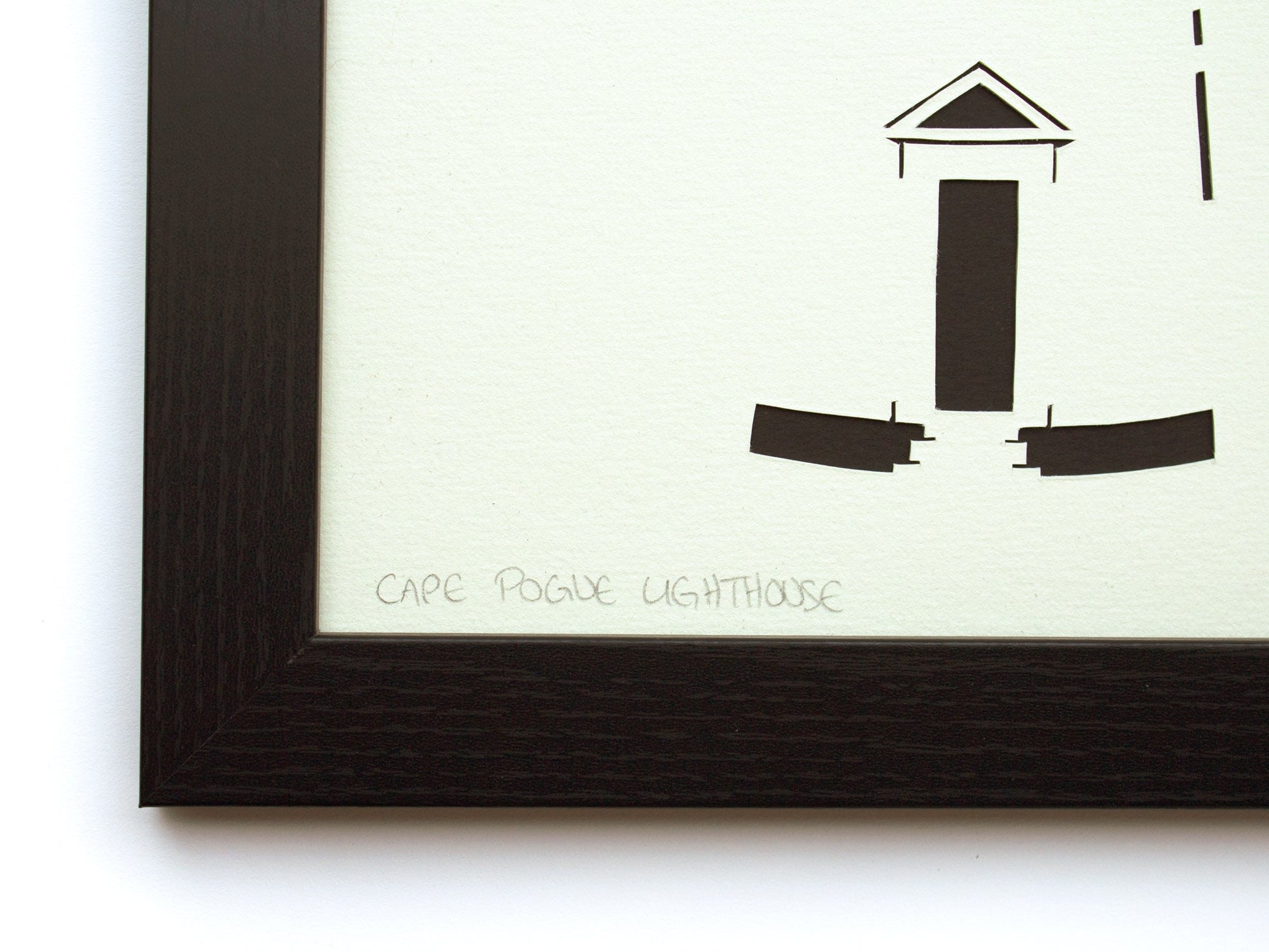 Framed simple black and white cut paper illustration of Cape Pogue Lighthouse on Chappaquiddick in Edgartown, Martha's Vineyard.