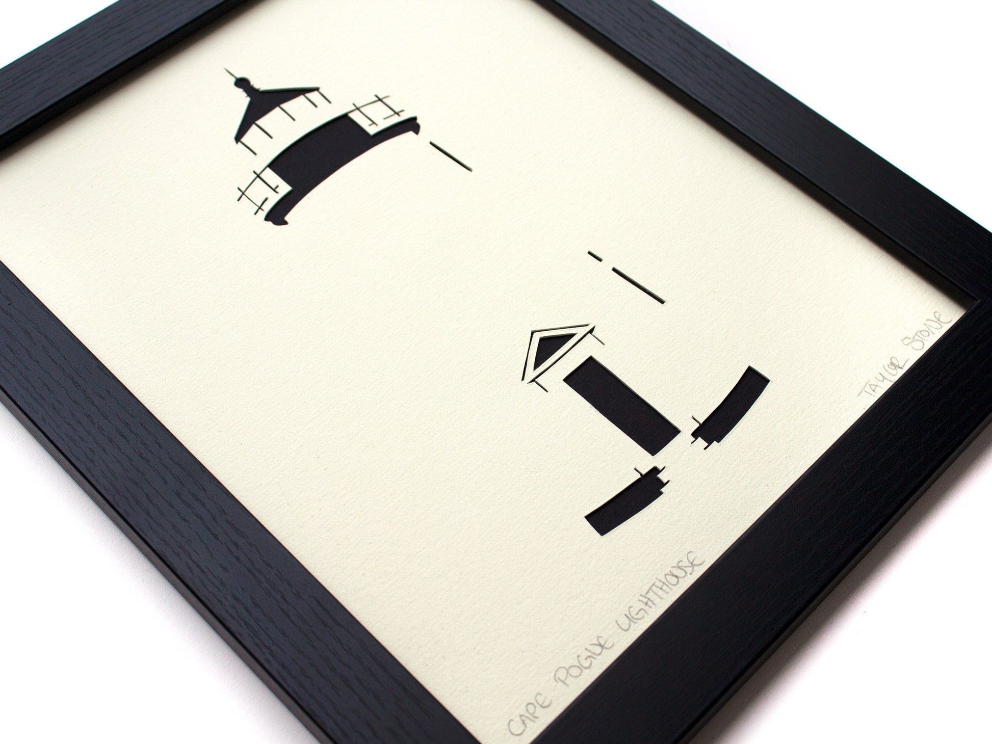 Framed simple black and white cut paper illustration of Cape Pogue Lighthouse on Chappaquiddick in Edgartown, Martha's Vineyard.