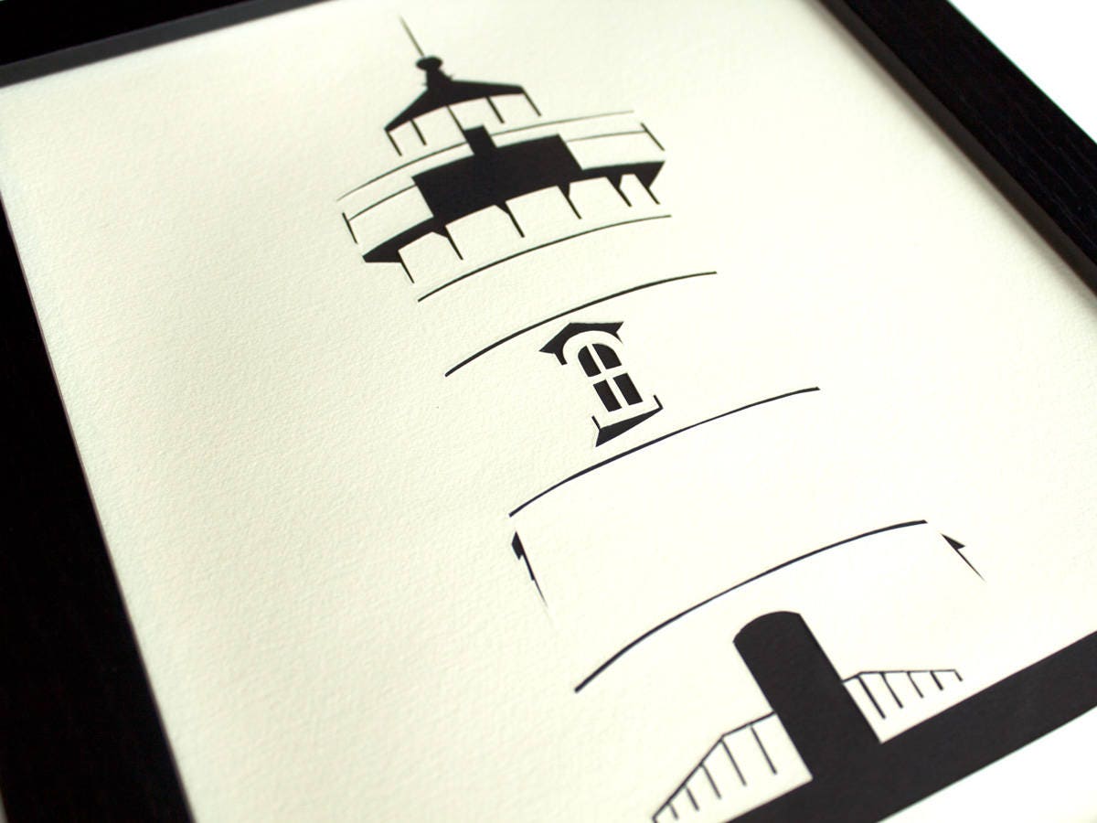 Framed simple black and white cut paper illustration of the Edgartown Light House on Martha's Vineyard