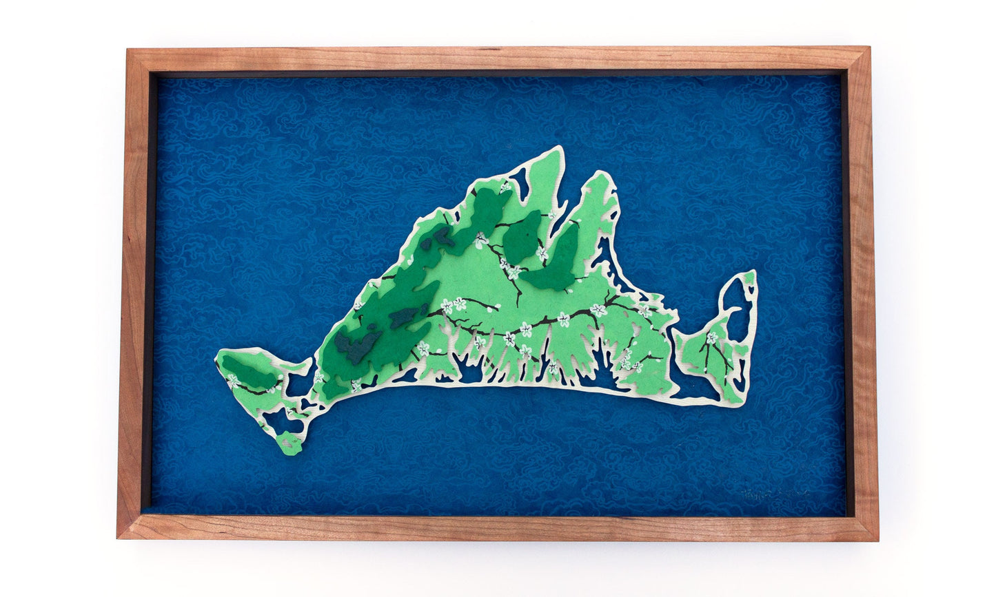 Framed original cut paper topographical map of Martha's Vineyard Island against beautiful blue Japanese paper background.