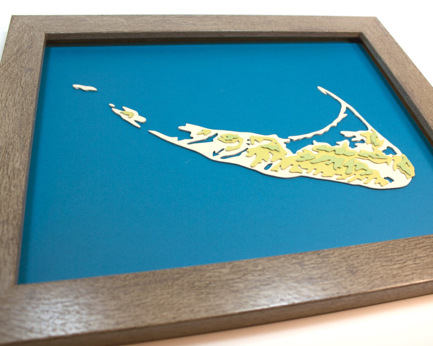 Framed original cut paper topographical map of Nantucket Island.