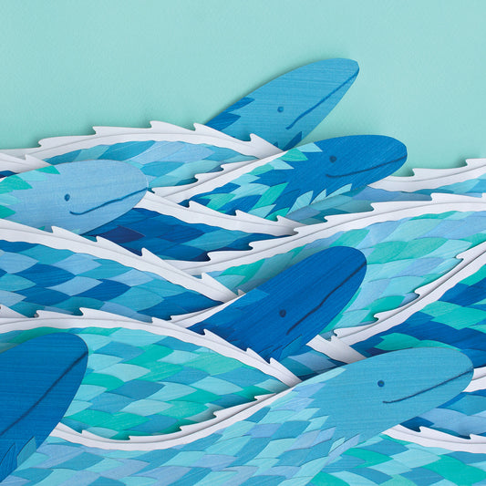 Archival print of cut paper illustration of several cute blue sea serpents swimming.