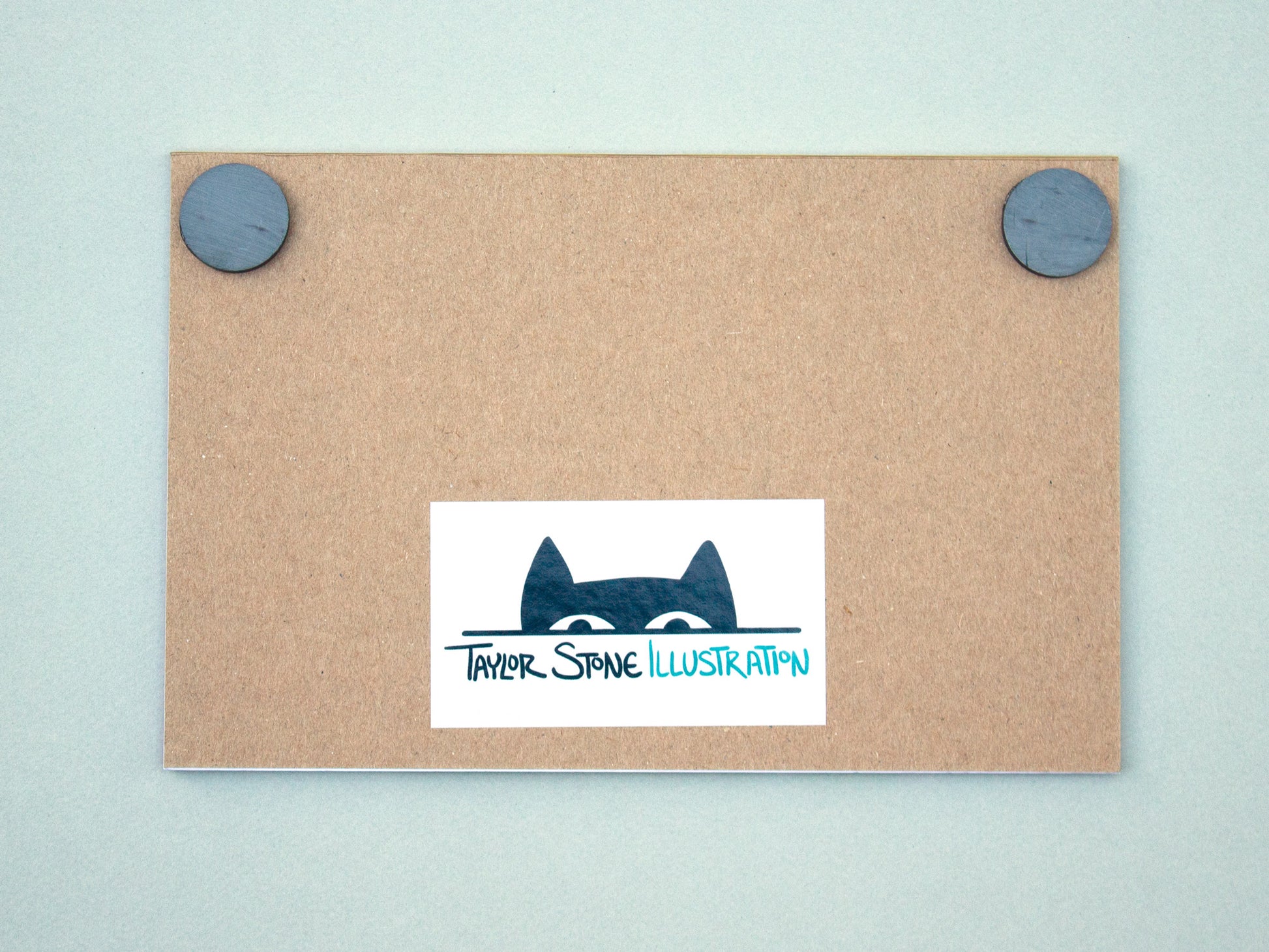 Back of notepad with magnet and Taylor Stone Illustration cat logo.