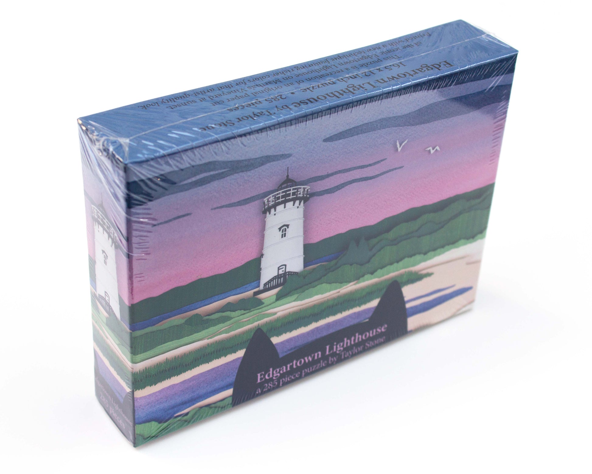 Cute jigsaw puzzle of cut paper illustration of the Edgartown Light House on Martha's Vineyard at sunset.