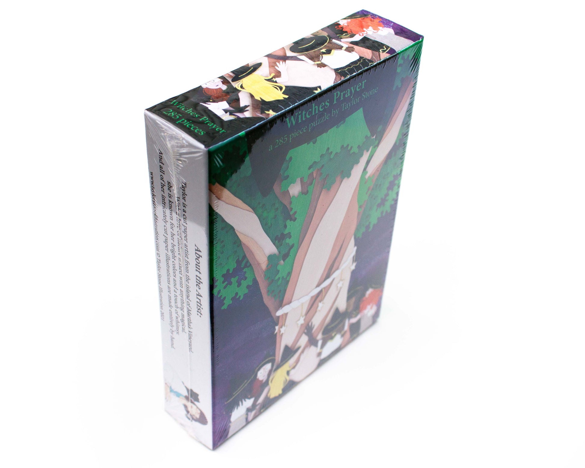 Cute jigsaw puzzle of cut paper illustration of little witches surrounding a big tree/