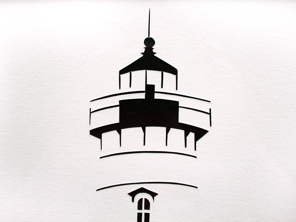 Framed simple black and white cut paper illustration of the Edgartown Light House on Martha's Vineyard