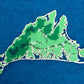 Framed original cut paper topographical map of Martha's Vineyard Island against beautiful blue Japanese paper background.