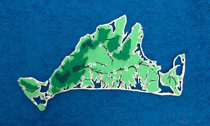 Framed original cut paper topographical map of Martha's Vineyard Island against beautiful blue Japanese paper background.
