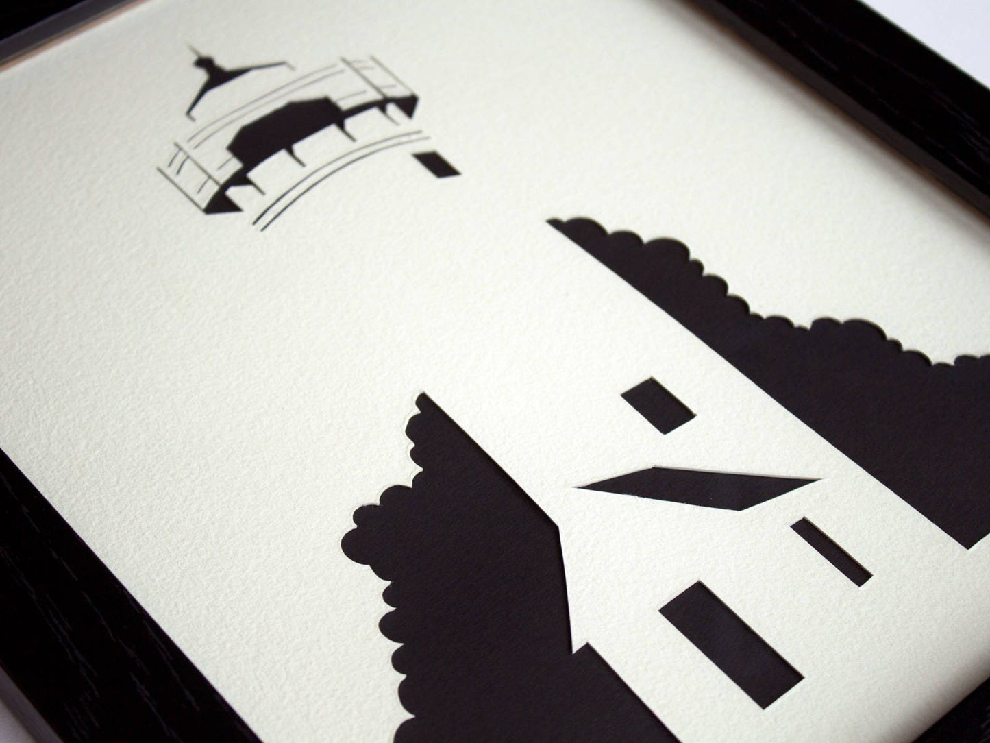 Framed simple black and white cut paper illustration of the West Chop Light House in Vineyard Haven, Martha's Vineyard.