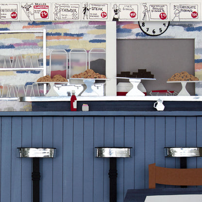 Original cut paper illustration inspired by Alice in Wonderland, featuring a whimsical scene of Alice, the white rabbit, and other characters from the story.