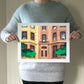 Archival print of cut paper illustration of two cute brownstone buildings.