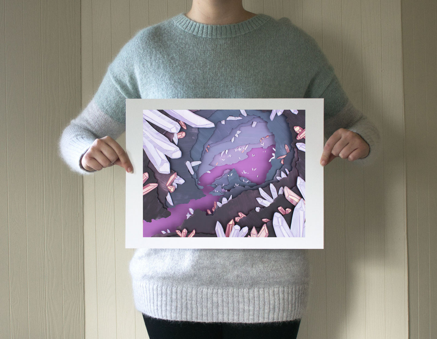 Archival print of cut paper illustration of a magical purple cave with crystals.