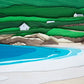 Archival print of cut paper illustration of Gurteen Beach at Dog's Bay, Ireland, showing details of cottages and shoreline
