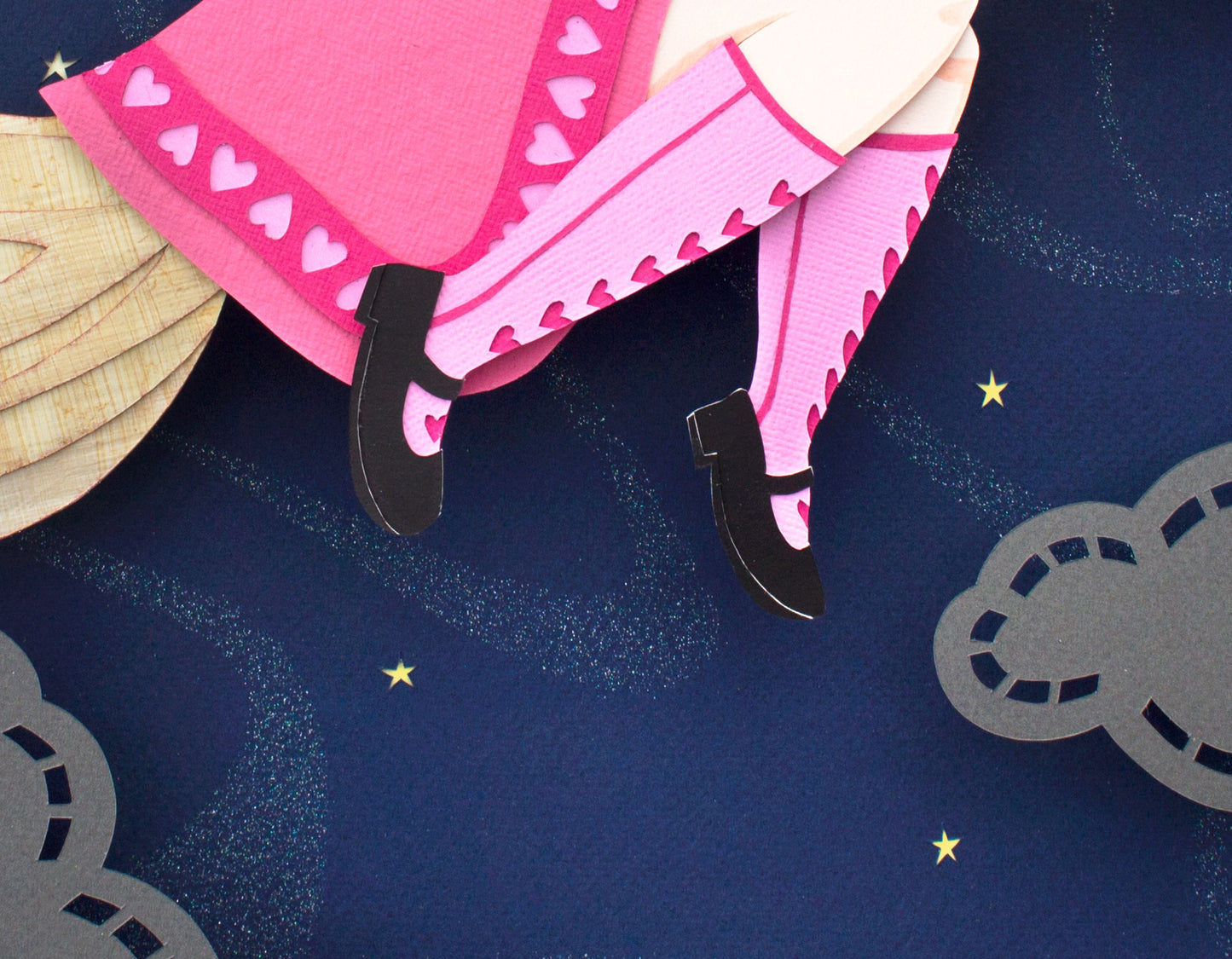 Archival print of cut paper illustration of cute witch in pink dress flying on broomstick with black cat.