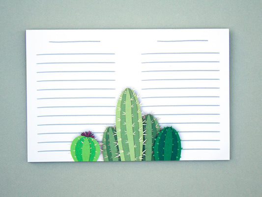 Cute notepad with cut paper illustration of cactus at the bottom.