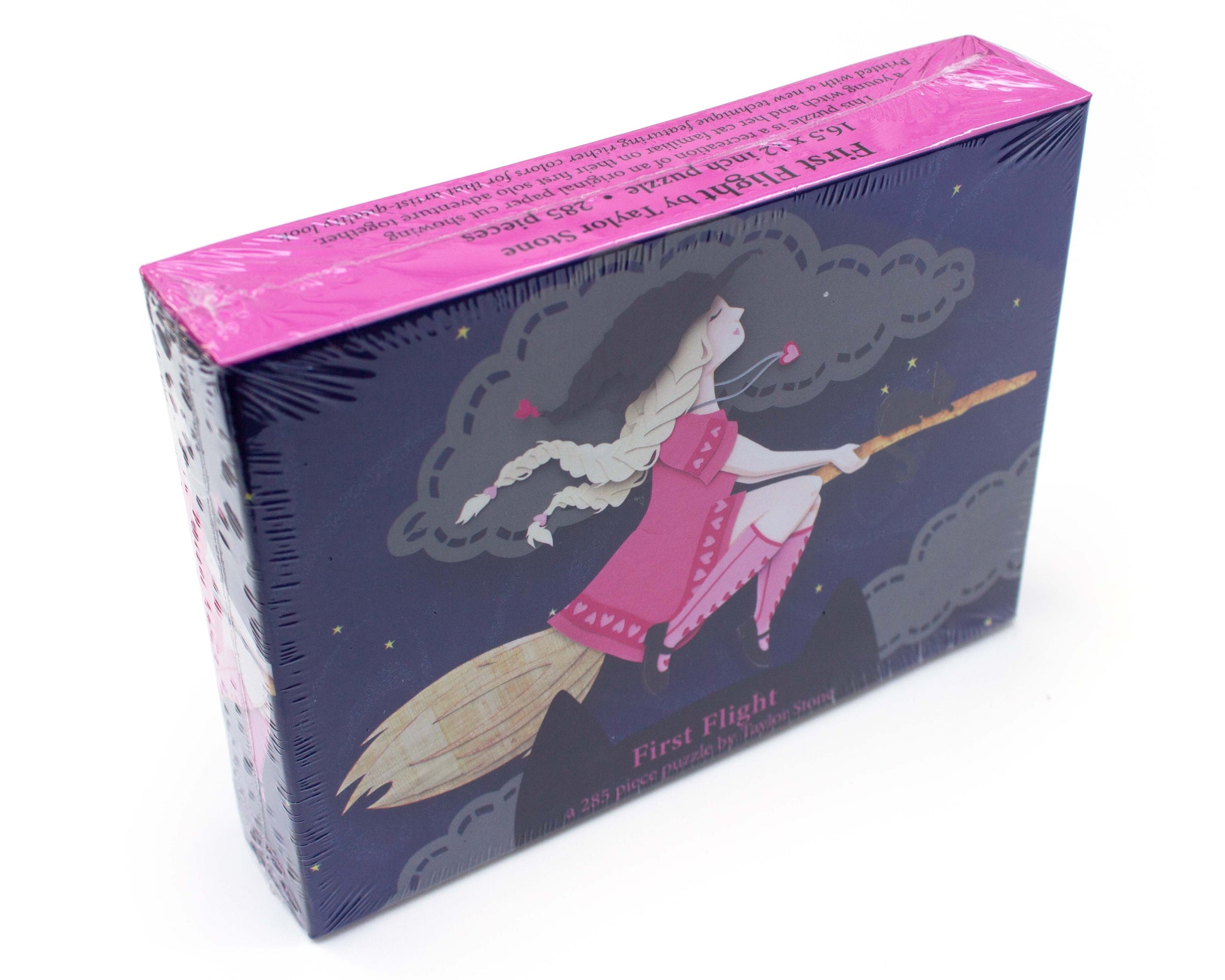 Cute jigsaw puzzle of cut paper illustration of witch flying on a broom at night with a black cat.