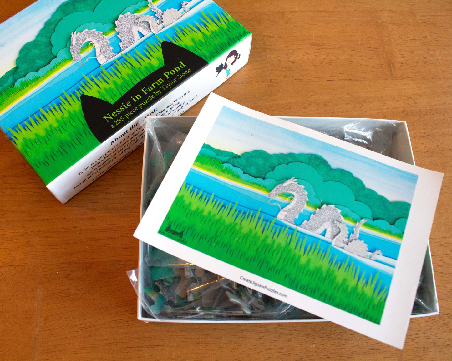 Cute jigsaw puzzle of cut paper illustration of Farm Pond in Oak Bluffs, on Martha's Vineyard with Nessie and her baby.